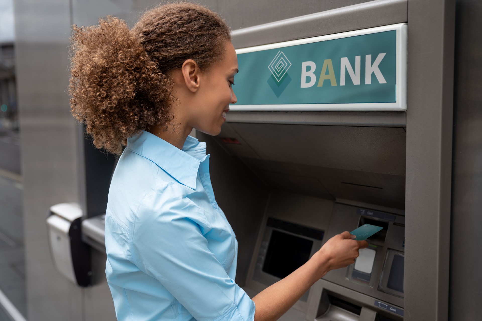 African American woman withdrawing money at an ATM